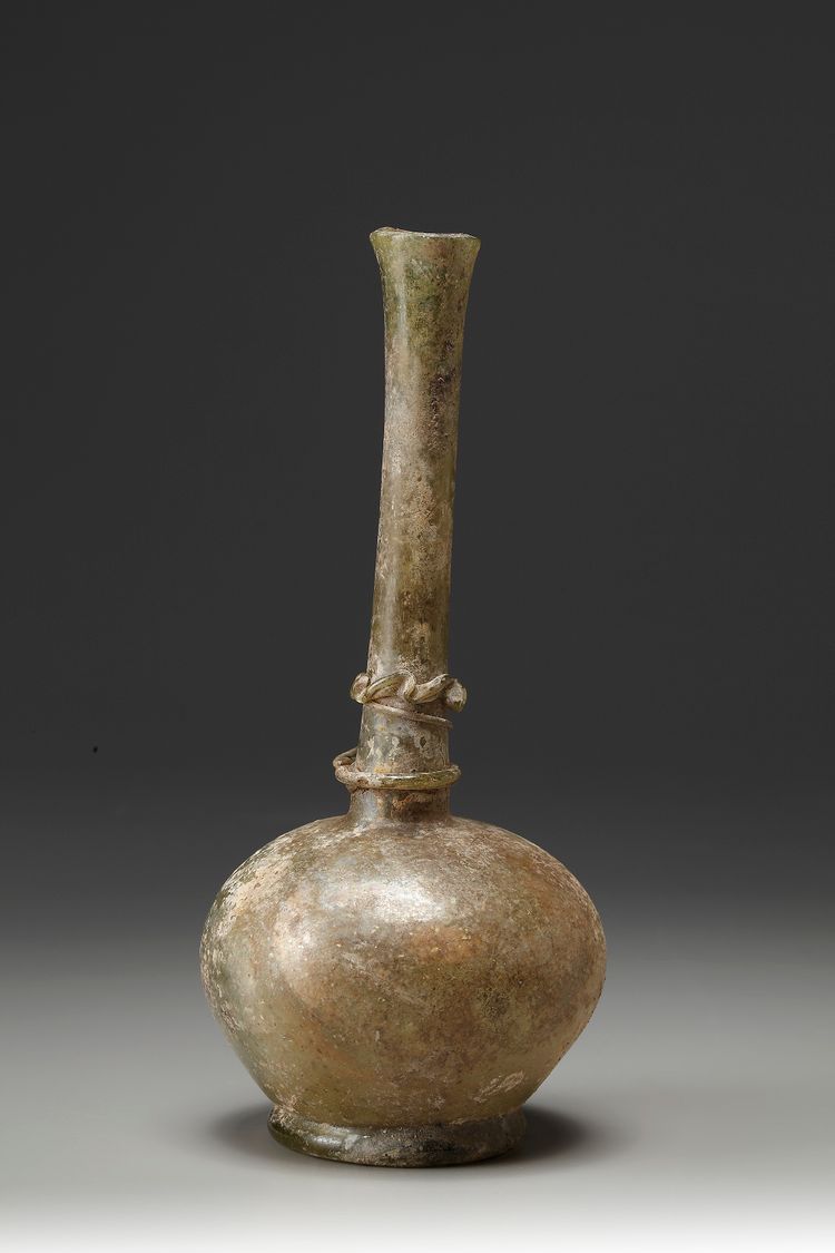 A Green Moulded Glass Bottle