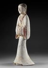 A LARGE TERRACOTTA STATUE OF A STANDING FEMALE ATTENDANT, CHINA, HAN DYNASTY (206 BC-206 AD)