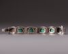 A silver filigree bracelet with Turquoise inlay