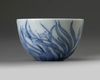 A small Chinese blue and white 'orchid' cup