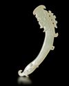 A LIGHT CELADON COLOR JADE OF AN "ANCESTRAL MASK' PENDANT, CHINA, POST SHIJIAHE CULTURE