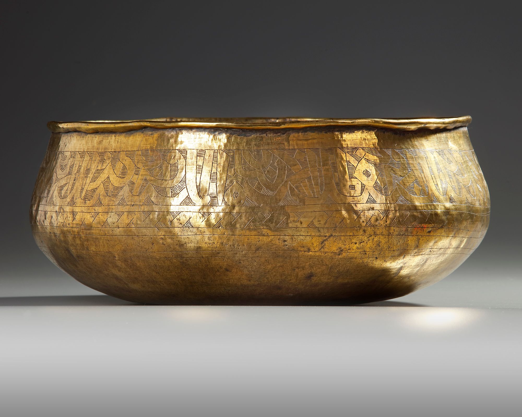 A MAMLUK BRASS BOWL, EGYPT OR SYRIA 13TH-14TH CENTURY