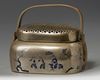 A Chinese brass 'narrative' hand warmer