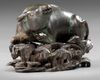 A CHINESE BRONZE BUFFALO ON A STAND, MING DYNASTY (1368-1644)