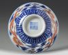 A CHINESE BLUE AND WHITE IRON-RED DECORATED 'DRAGON' BOWL, SIX-CHARACTER JIAQING MARK AND OF THE PERIOD (1796-1820)