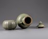 A celadon glazed vase with cover and a waterpot