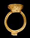 A GOLD INSCRIBED SEAL RING