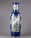 A blue glazed famille verte rouleau vase