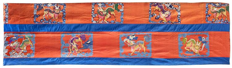 A LARGE CHINESE RED-GROUND SILK EMBROIDERY, 19TH CENTURY