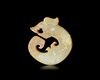 A YELLOWISH-GREEN JADE DRAGON, CHINA, SHANG DYNASTY