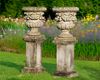 A PAIR OF CARVED LIMESTONE GARDEN URNS, LATE 19TH CENTURY