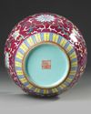 A CHINESE FAMILLE ROSE RUBY GROUND VASE, 19TH/20TH CENTURY