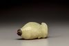 A yellow bowenite 'fish' snuff bottle