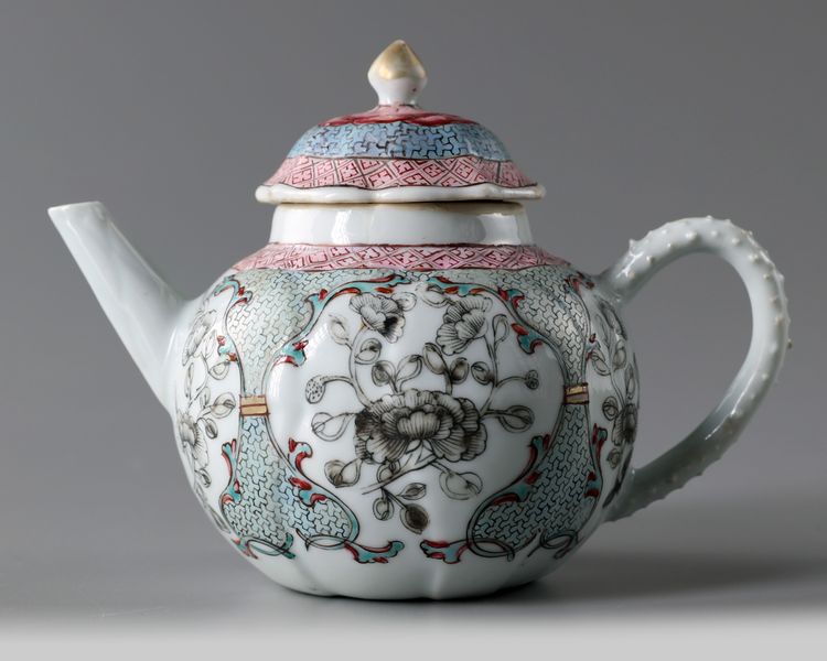 A Chinese famille rose moulded 'floral' teapot and cover
