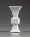 A small Chinese white- glazed gu vase