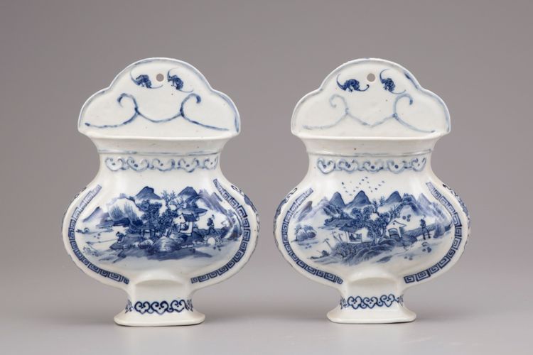 A pair of blue and white porcelain wall vases