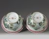 A pair of Chinese famille rose jardinieres and stands
