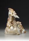 A JAPANESE SATSUMA FIGURE OF SEATED JUROJIN AND A DEER, MEIJI PERIOD (1868-1912)