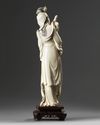 A large Chinese ivory carving of a lady holding a parasol