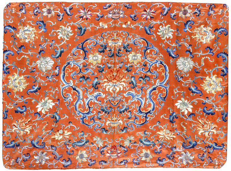A CHINESE EMBROIDERED SILK PANEL DECORATED WITH DRAGONS AND  FLOWERS ON A BRIGHT RED GROUND, 19TH CENTURY