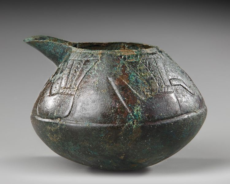 A WESTERN ASIATIC BRONZE SPOUTED VESSEL, CIRCA 8TH-7TH CENTURY B.C.