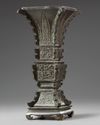 A Chinese archaistic bronze square section vase, fanggu