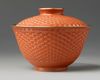A Chinese imitation-cinnabar lacquer bowl and cover
