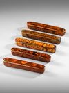 A GROUP OF FIVE QAJAR LACQUERED PAPIER-MACHÉ PEN CASES (QALAMDAN), 19TH CENTURY