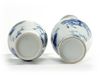 A matched pair of Chinese blue and white twin-handled slender vases