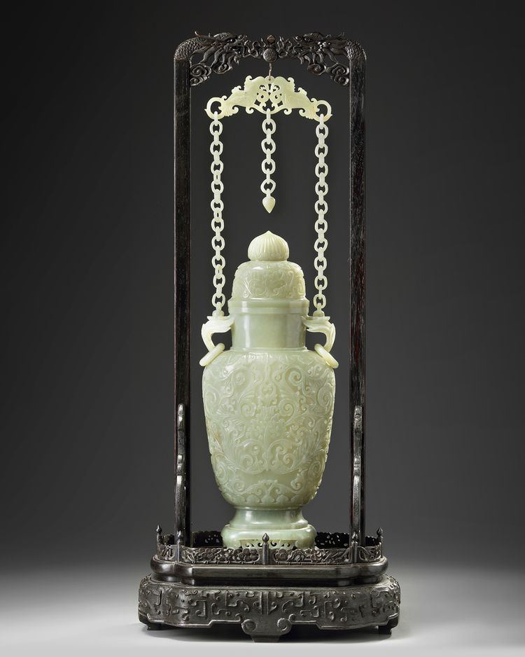 A Chinese pale celadon jade vase and cover