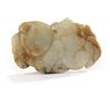 A Chinese pale celadon and russet jade 'boy and lingzhi' carving