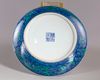 A Chinese blue ground green-enamelled 'dragon' charger