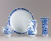 A group of four blue and white objects