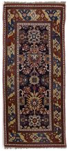 AN ANTIQUE CAUCASIAN RUG RUNNER