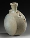 A LARGE PARTHIAN GLAZED PILGRIM FLASK, CIRCA 1ST-2ND CENTURY A.D.