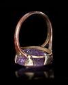 AN AMYTHYST INTAGLIO MOUNTED IN A MODERN RING, ROMAN, 3RD CENTURY AD