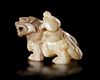 A CHINESE JADE OF AN IMMORTAL RIDING A BIXIE,  HAN DYNASTY (206 BC–220 AD)