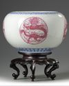 A pair of Chinese famille rose 'dragon' jardinieres