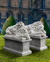 A PAIR OF SCULPTED LIMESTONE MODELS OF SLEEPING LIONS MID 20TH CENTURY, LOOSELY AFTER THE MANNER OF ANTONIO CANOVA (VENETIAN 1757-1822)