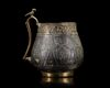A VERY RARE AND IMPORTANT EARLY ISLAMIC PARCEL-GILT CUP