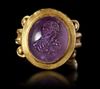 A ROMAN GOLD RING WITH AMETHYST INTAGLIO, CIRCA 2ND-3RD CENTURY A.D.