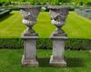 A PAIR OF LIMESTONE GARDEN URNS, LATE 19TH OR EARLY 20TH CENTURY