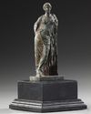A ROMAN BRONZE STATUETTE OF APHRODITE / VENUS LEANING ON A PILLAR, CIRCA 1ST CENTURY B.C - A.D.