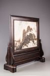 A marble 'dreamstone'-inset wood screen
