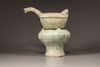 A GREEN-GLAZED RED POTTERY MODEL OF A YI, A LADLE AND BRAZIER, HAN DYNASTY (206 BC - 220 AD)