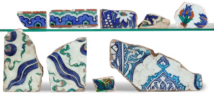A GROUP OF NINE IZNIK TILE SHARDS, OTTOMAN, 16TH CENTURY