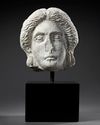 A MARBLE HEAD OF APOLLO, ROMAN 1ST CENTURY AD