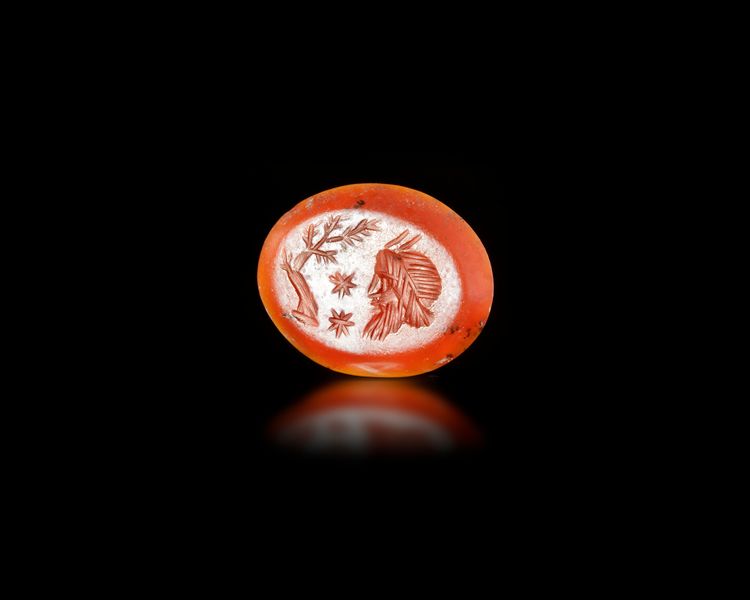 A CARNELIAN INTAGLIO OF A HEAD OF A SATYR, 1ST-2ND CENTURY AD