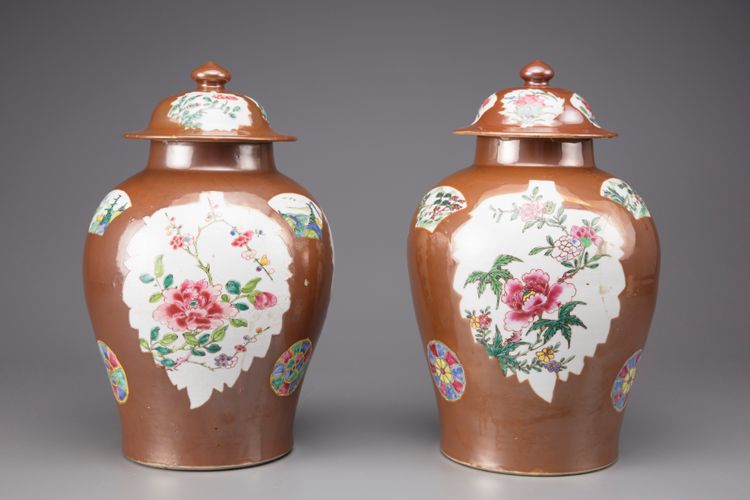 A pair of café au lait vases with covers