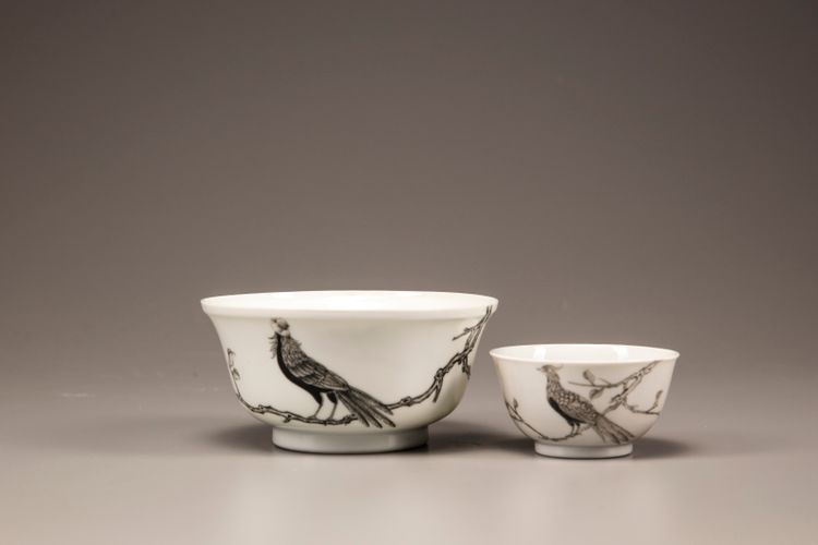 An en grisaille 'pheasant' tea cup and bowl